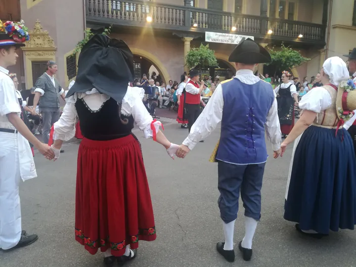 Folklore dancing in the evening at Colmar, Alsace (France)